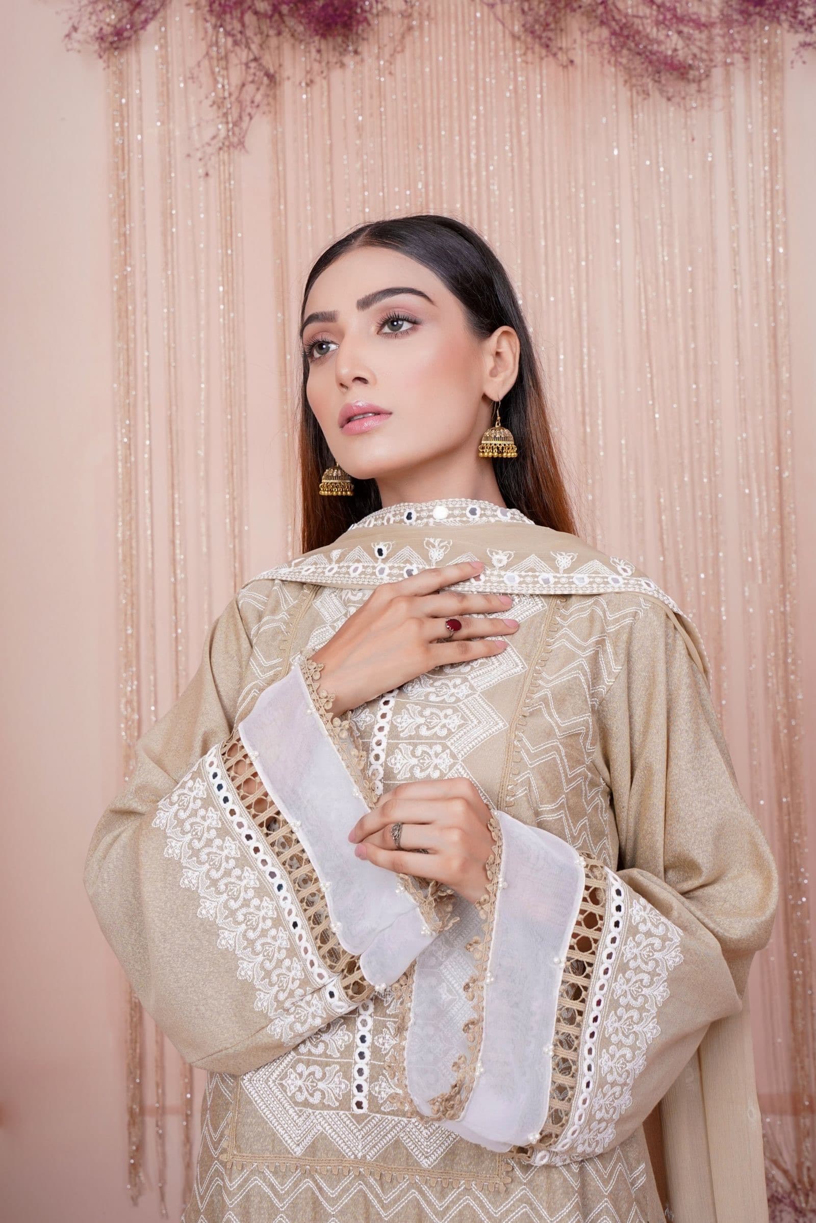 A model in a sand-coloured embroidered kurta