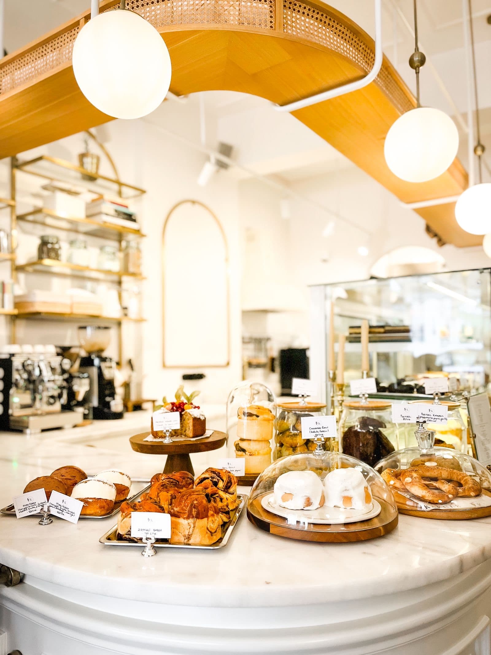 Pastries and cakes on the counter of a bright bakery